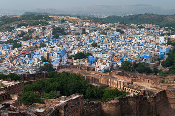 Fototapeta premium Beautiful top view of Jodhpur city from Mehrangarh fort, Rajasthan, India. Jodhpur is called Blue city since Hindu Brahmis there worship Lord Shiva, whose colour is blue, they painted houses in blue.