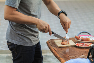 Blurred images , A group of colleagues held a barbecue party. (BBQ) inside the villa after work to celebrate success. Barbecue (BBQ) Allows family members and friends to have activities together.
