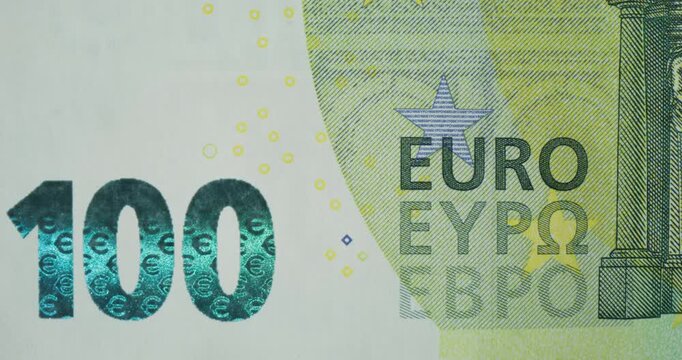 An overview of the hundred euro banknote. Quick frame change with different parts of the banknote in close-up