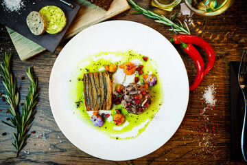 Shiitake and potatoes. Vegan. Shiitake mushroom, potato gratin, Beluga lentils, yellow beet cream. Delicious healthy traditional food closeup served for lunch in modern gourmet cuisine restaurant