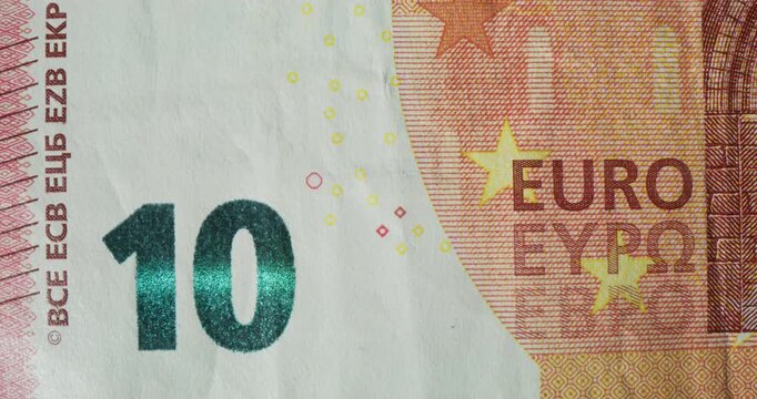 An overview of the 10 euro banknote. Quick frame change with different parts of the banknote in close-up