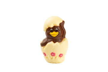 Obraz premium Easter Chocolate Chick isolated on white background. Easter celebration concept. Happy Easter. Chocolate sweet eggs. Candies on textured table. Space for text.Copy space