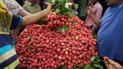Freshly picked ripe lychees, ready for sale at the market. Vibrant colors and juicy sweetness of this tropical delight, straight from the orchard to your table. Lychee, Litchi, Lichee, fruit