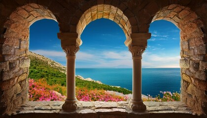 Fototapeta premium Medieval stone arch windows with a romantic view of the summer sea