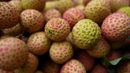 Freshly picked ripe lychees, ready for sale at the market. Vibrant colors and juicy sweetness of this tropical delight, straight from the orchard to your table. Lychee, Litchi, Lichee, fruit