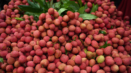 Freshly picked ripe lychees, ready for sale at the market. Vibrant colors and juicy sweetness of this tropical delight, straight from the orchard to your table. Lychee, Litchi, Lichee, fruit