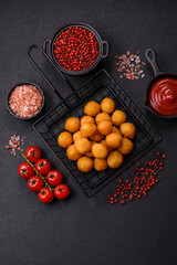 Cheese or potato balls breaded with salt, spices and herbs