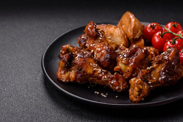Delicious crispy baked chicken wings in teriyaki sauce