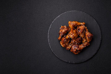 Delicious crispy baked chicken wings in teriyaki sauce
