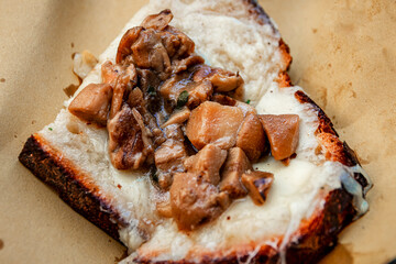 a bruschetta with porcini mushrooms and caciocavallo