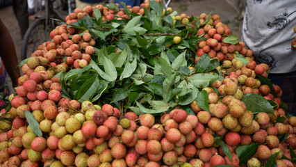 Freshly picked ripe lychees, ready for sale at the market. Vibrant colors and juicy sweetness of this tropical delight, straight from the orchard to your table. Lychee, Litchi, Lichee, fruit