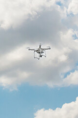 Drone high in the bright summer sky. vertical
