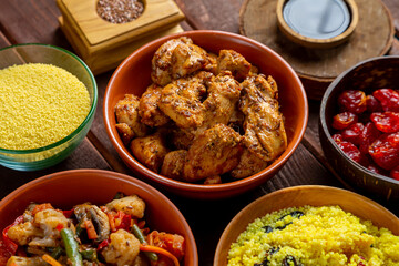 Traditional Moroccan table couscous vegetables chicken and dried fruits. Horizontal photo.