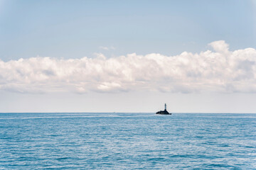 Scenic landscape with Nachi Katsuura Katsuoshima Lighthouse on the Pacific Ocean coast in Nachikatsuura, Wakayama, Japan.