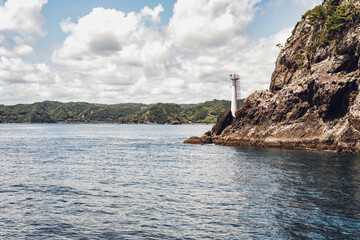 Scenic landscape with Ugui Komazaki Lighthouse on the Pacific Ocean coast in Nachikatsuura, Wakayama, Japan.