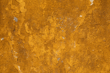A textured wall with a rich golden hue