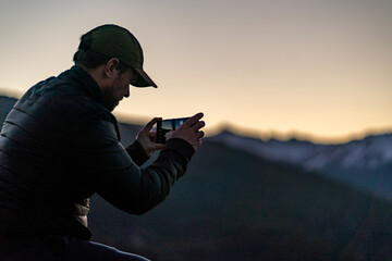 male hiker photographer hiking in the woods of Traful lake in Patagonia mountains in Argentina