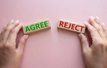 Agree or Reject symbol. Concept word Agree or Reject on wooden blocks. Businessman hand. Beautiful...