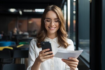 Taking Document Picture Or Photo With Phone woman using mobile smartphone invoice receipt paper scanning statement payment method transaction credit bill with technology finance, girl client