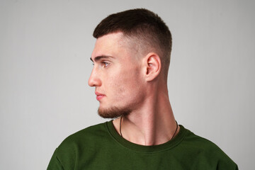 Fototapeta premium Young Man With Short Hair Looking To The Side