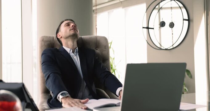 Mature 40s businessman sit at desk read email, becomes stressed, showing negative reaction on e-mail, get bad news with awful distressing information, project failure, financial loss. Issue, concerns