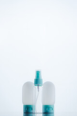 Means for face and body care. A complex of organic care products. Bottles for the transportation of cosmetics traveling by plane. Clean color palette.