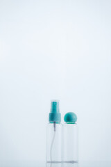 Means for face and body care. A complex of organic care products. Bottles for the transportation of cosmetics traveling by plane. Clean color palette.