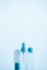 Means for face and body care. A complex of organic care products. Bottles for the transportation of cosmetics traveling by plane. Clean color palette.