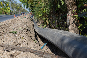 Construction site with new Water Pipes in the ground. sewer pipes to repair or restore in street...