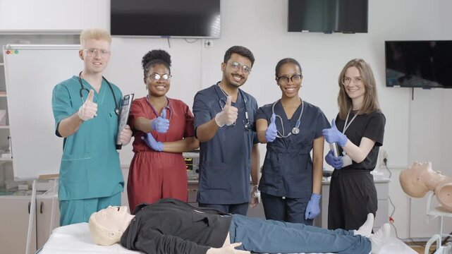Group of foreign students in first aid training give a thumbs up