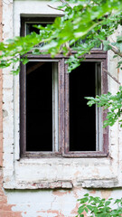 Smashed glass Window with old wooden frame. abandoned building. old window. finely broken glass. old house, retro. cracked window frame. cracked old paint, pieces of glass. horror, halloween