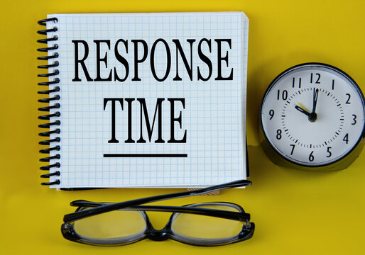 RESPONSE TIME - words in a white notebook with alarm clock and magnifying glass