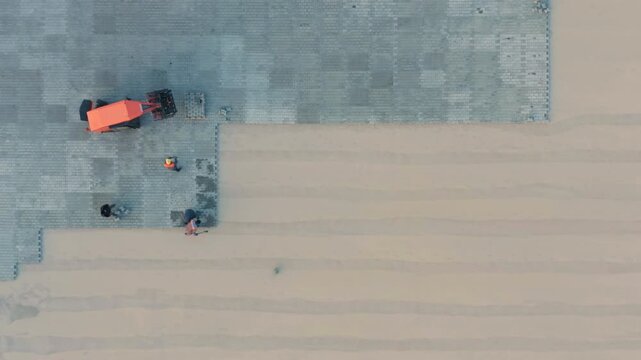 Innovative Paving Stone Laying Machine Transforms Urban Walkway | Aerial Top Down View of Efficient Sidewalk Reconstruction | Drone Captures Cutting-Edge City Infrastructure Enhancement