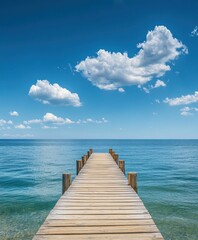 Obraz premium Wooden dock extending into the sea, blue sky with white clouds, background, flat composition