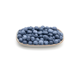 Fresh clean blueberries berries in a plate isolated on a white background. Healthy food concept.