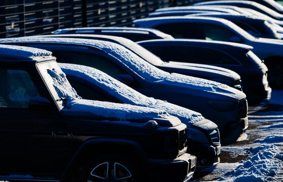 Gothenburg, Sweden - January 07 2024: Cars paked on a dealership back lot in winter.