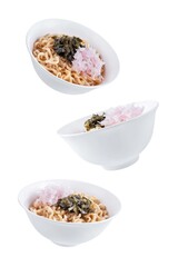 Ramen noodles with seaweed and radish in a bowl on a white isolated background