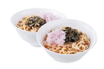 Ramen noodles with seaweed and radish in a bowl on a white isolated background