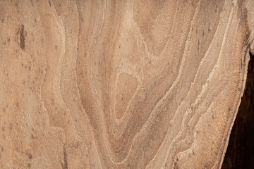 Expensive vintage furniture. The table is covered with epoxy resin and varnished. Luxury quality wood processing. Wooden table on a dark background. Black river made of epoxy resin.