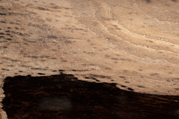 Expensive vintage furniture. The table is covered with epoxy resin and varnished. Luxury quality wood processing. Wooden table on a dark background. Black river made of epoxy resin.