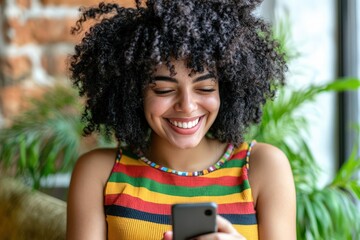 Happy young woman enjoying her phone on the couch in her living room