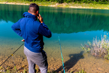 A young man fishing and worries that he will not catch any fish.