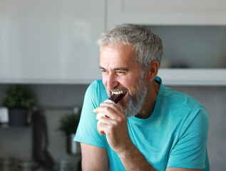 kitchen food man healthy morning breakfast active fitness diet bar snack protein  mature energy chocolate home healthy eating senior adult