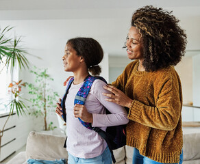 child mother family education school girl home daughter backpack help parent getting ready elementary teen morning hug love helping together black