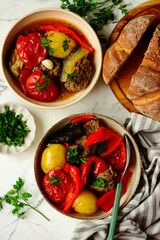 Cutlets with vegetables in a cauldron in Azerbaijani style.