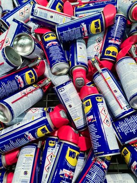 Kiel, Germany - 08 August 2024: WD40 brand penetrating oil in cans for sale