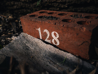 Red brick with number