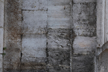 Fototapeta premium Weathered stone wall with a hint of history