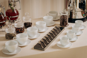 Coffee or tea cups on catering table at conference or wedding banquet table