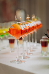 Welcome drink with cocktail glasses and drinks at an event. Alcoholic beverages at a wedding